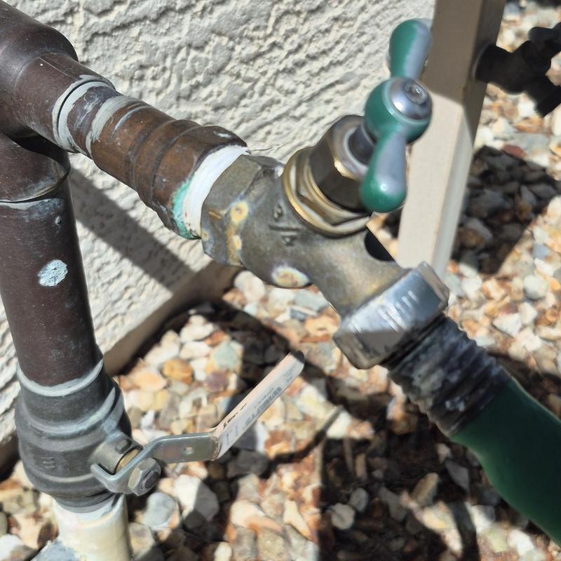 Outdoor hose bib with attached garden hose fitting