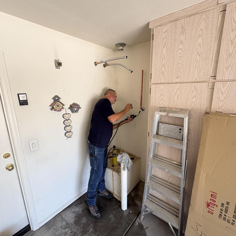 50 Gallon gas water heater installation setup in garage