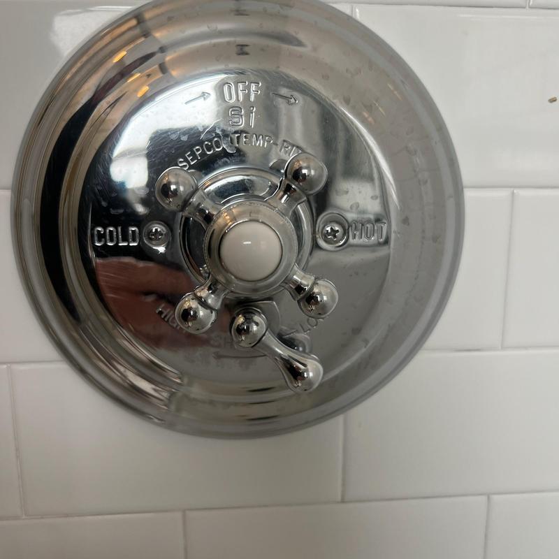 Shower faucet handle with temperature control knob