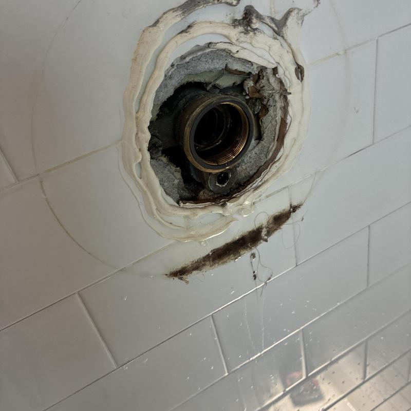 Shower faucet valve opening with sealed wall damage