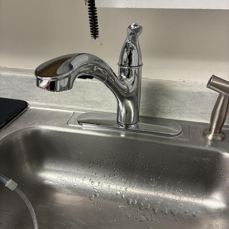 Moen utility sink faucet installed on stainless steel sink