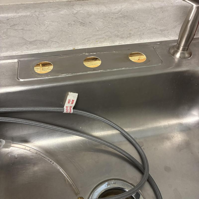 Utility sink faucet mounting holes with supply lines