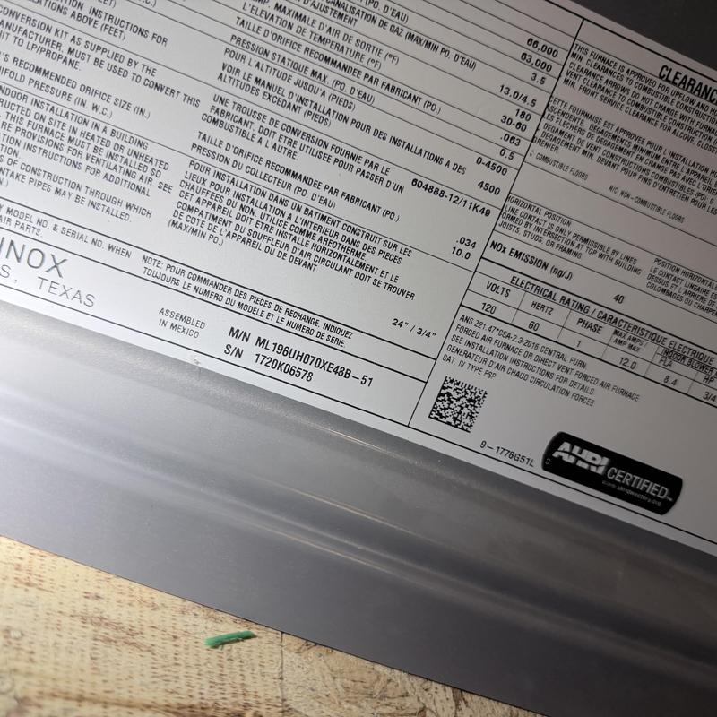 Gas furnace specification and safety label close-up Gas furnace specification and safety label close-up