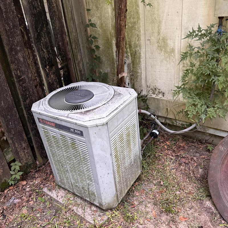 Trane XE 800 heat pump outdoor unit with rust