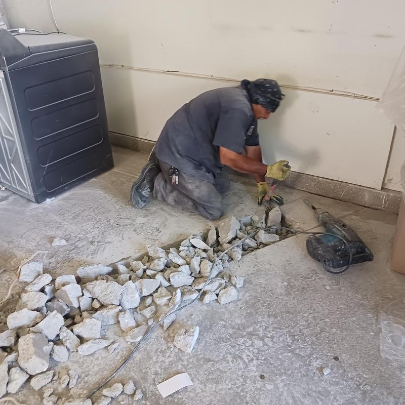 Concrete floor breaking for sewer line reroute