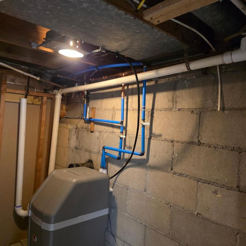 Water softener installation with blue PEX piping