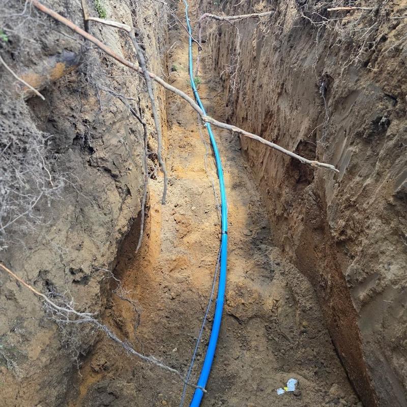 1 inch water service poly pipe with tracer wire in trench