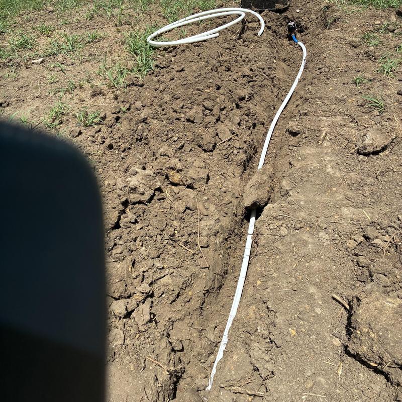 Water service line installation in dirt trench Water service line installation in dirt trench
