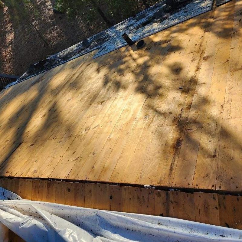 Wooden roof decking installation on residential roof