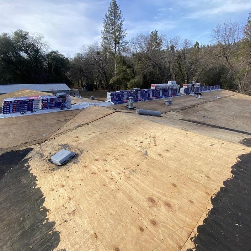 GAF asphalt roof decking with shingles stacked