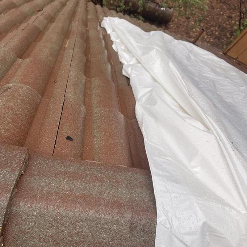 Tile roof with protective white tarp in Murphys, CA