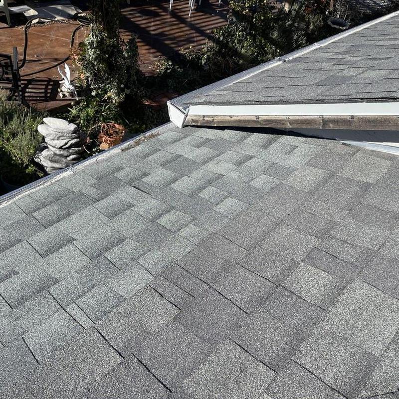 Asphalt shingle roof with new gutter installation in Sonora