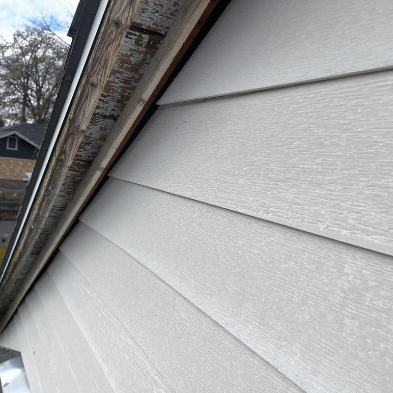 Vinyl siding installation on residential home exterior