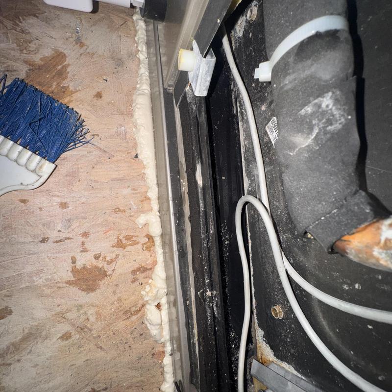 Heat pump drain line with insulation foam and broom
