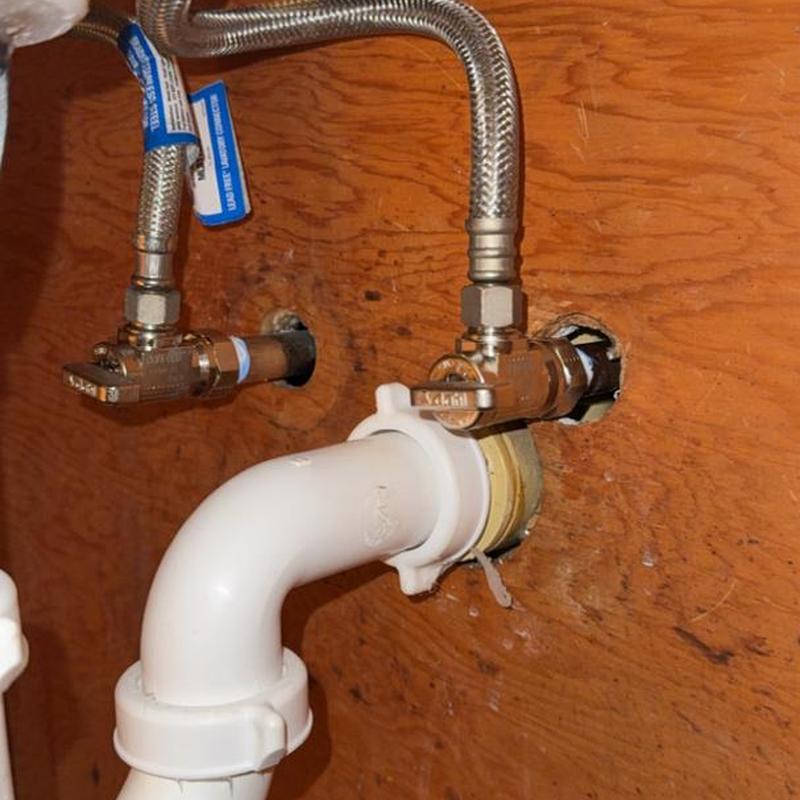 Bathroom sink water supply valves and drain pipe connections