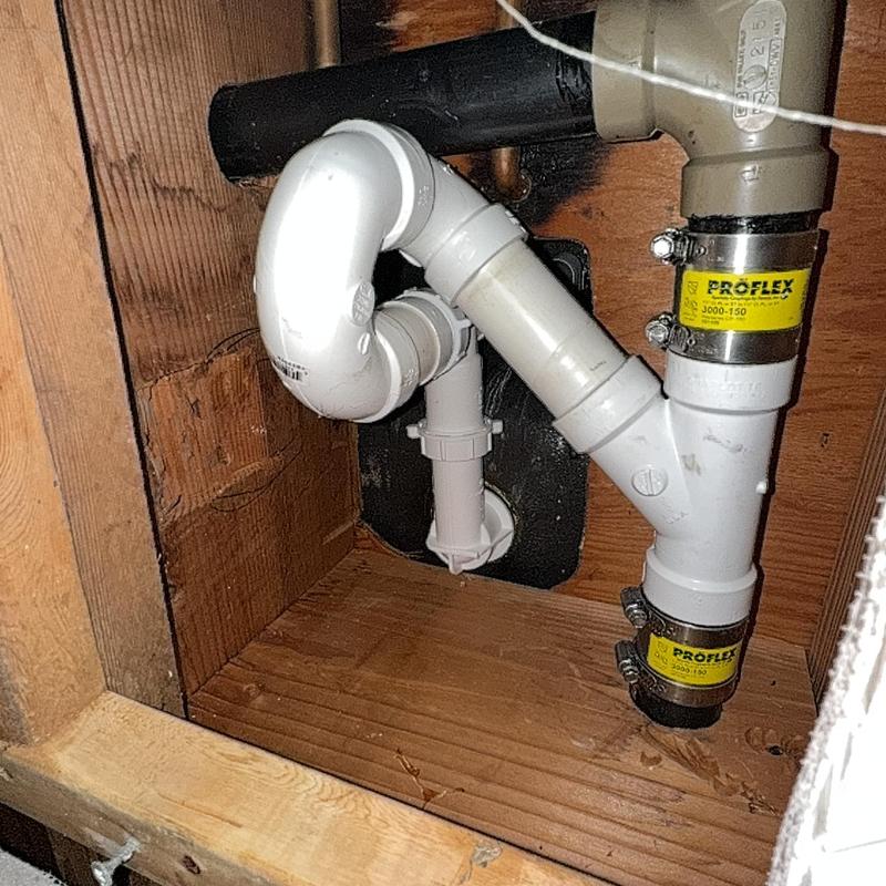 Bathtub drain plumbing with flexible couplings installed