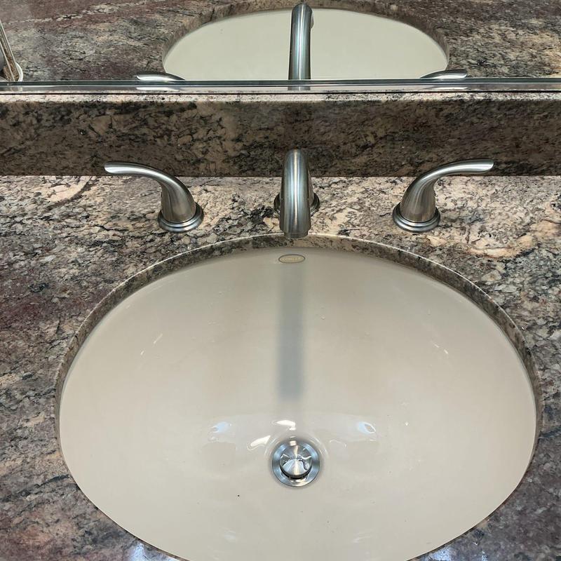 Widespread bathroom faucet and pop-up drain assembly