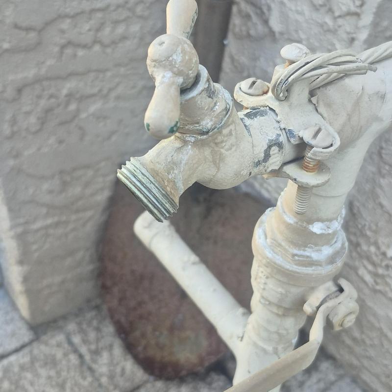Outdoor hose bib with corrosion and mounting bracket
