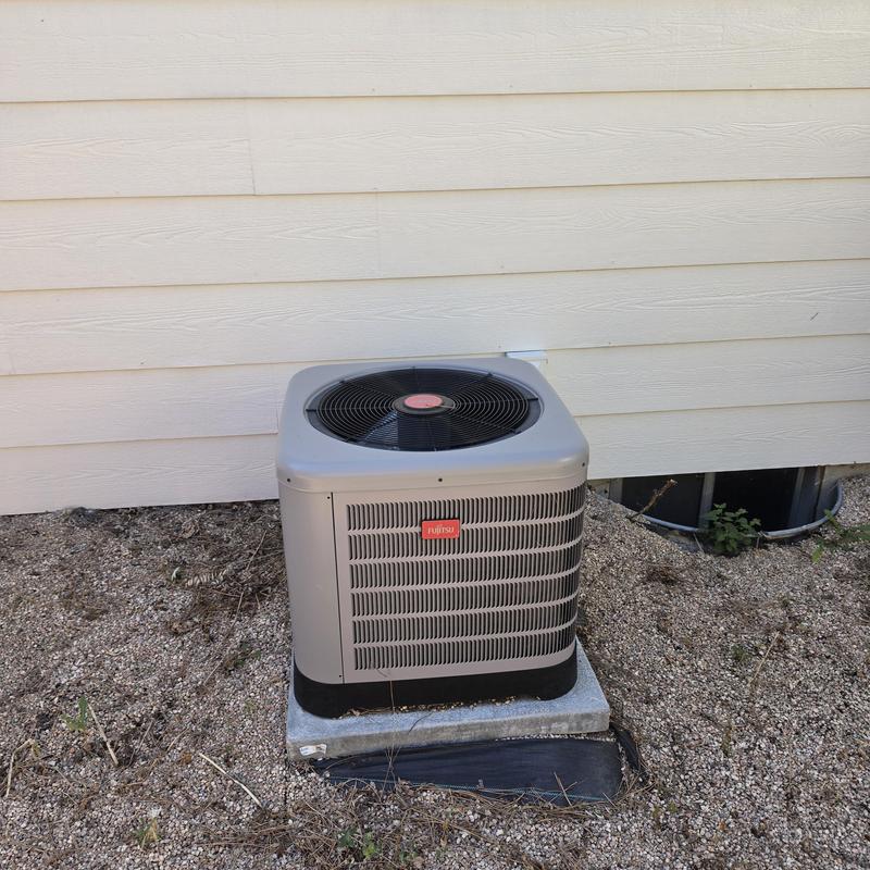 Fujitsu air conditioner unit outside home installation