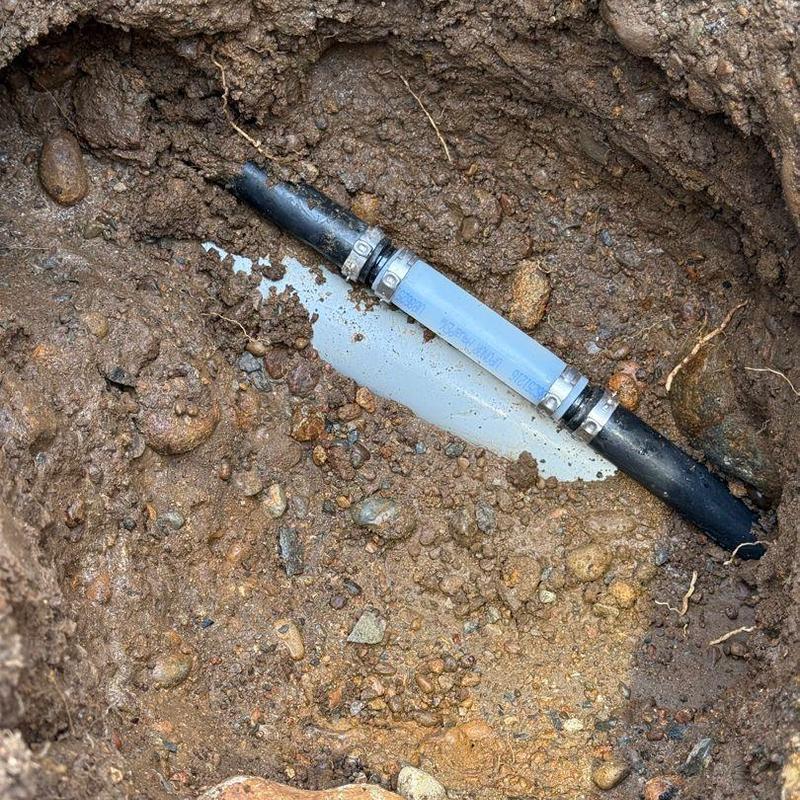 1" PVC main line pipe repair with couplings in trench 1" PVC main line pipe repair with couplings in trench