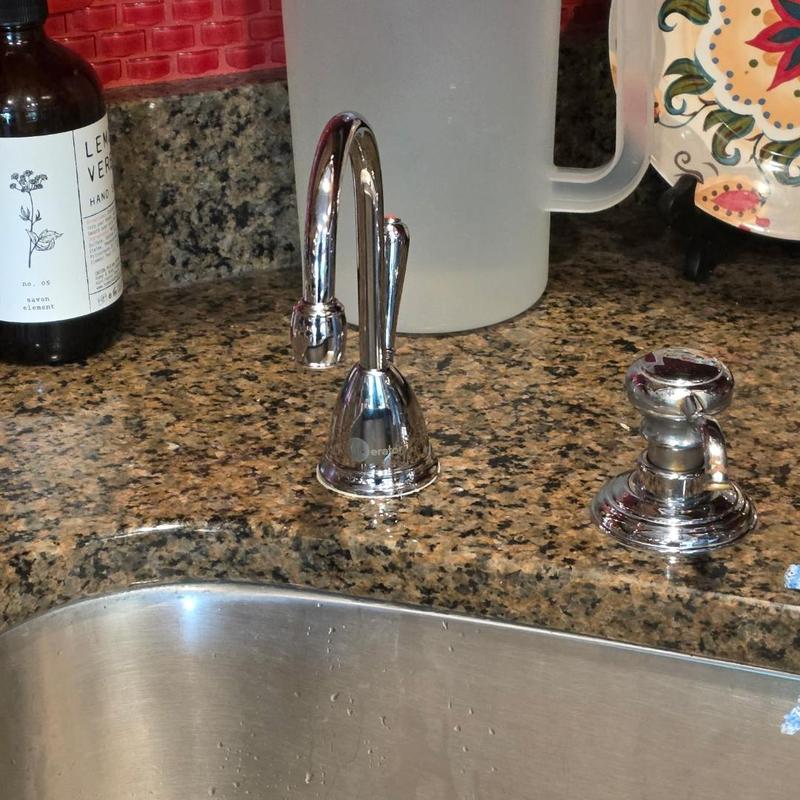 Instant hot water faucet installed on granite countertop Instant hot water faucet installed on granite countertop