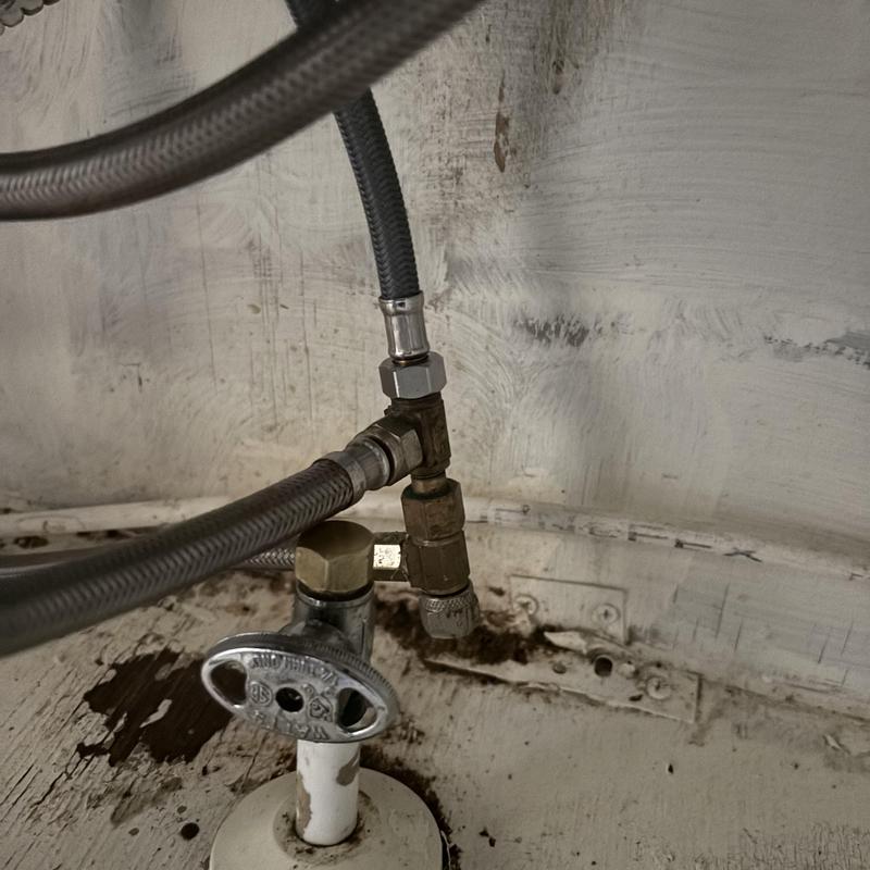 Angle stop valve with capped plumbing lines under sink Angle stop valve with capped plumbing lines under sink