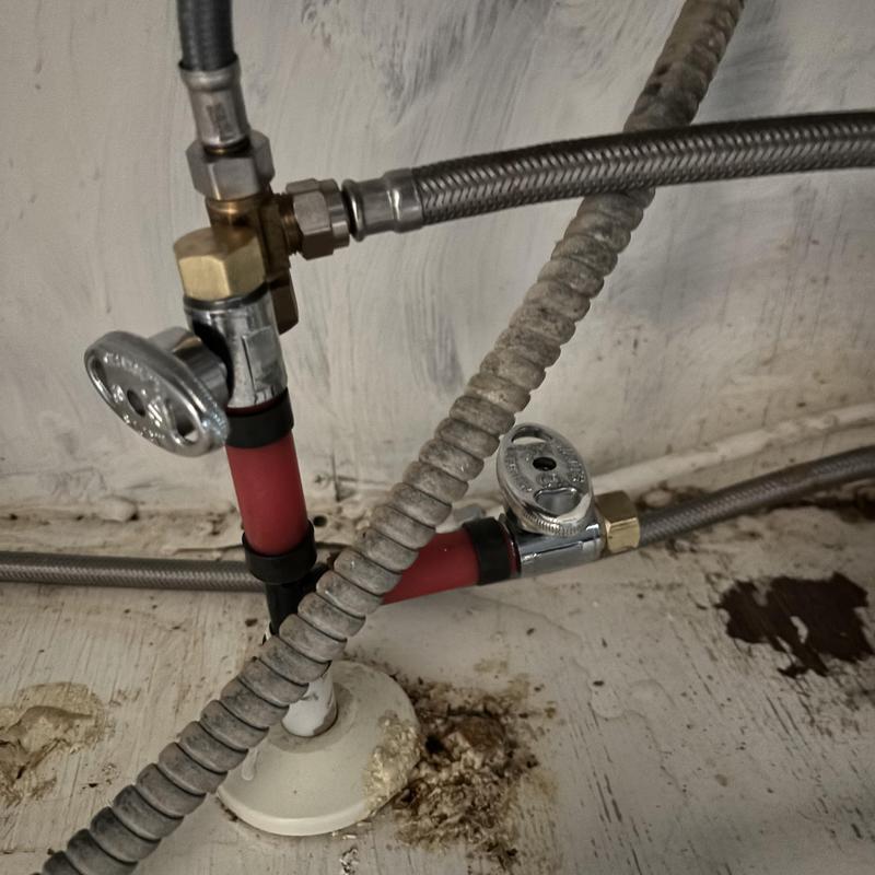 Angle stop valves with capped water lines under sink Angle stop valves with capped water lines under sink