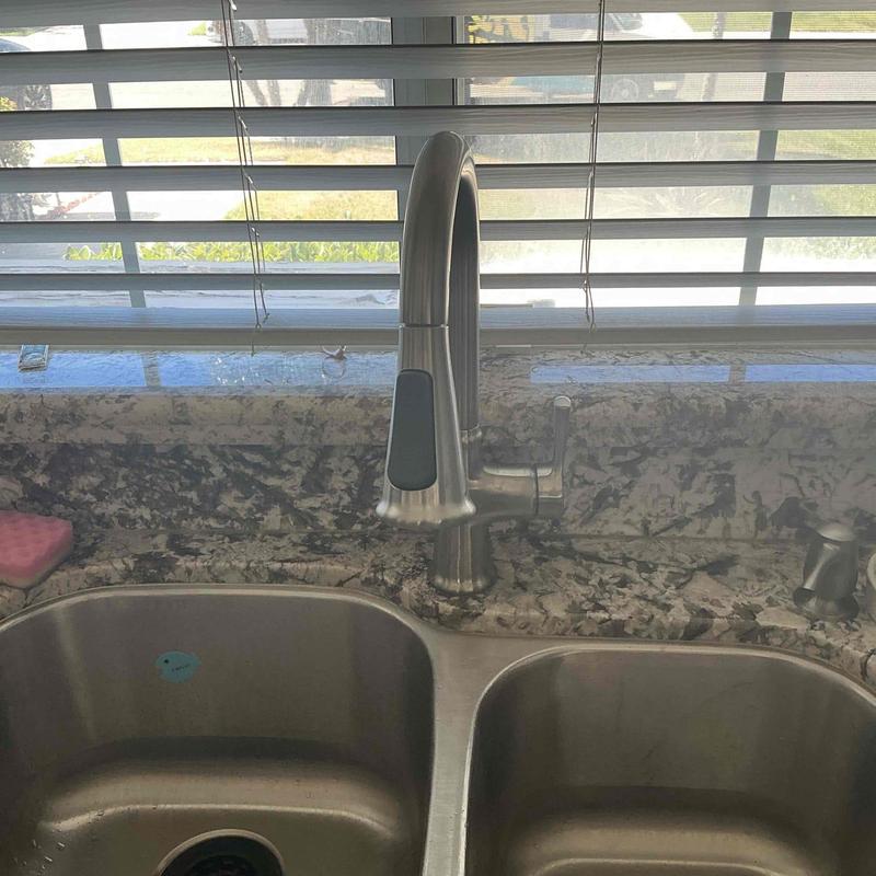 Kitchen faucet installation over double sink