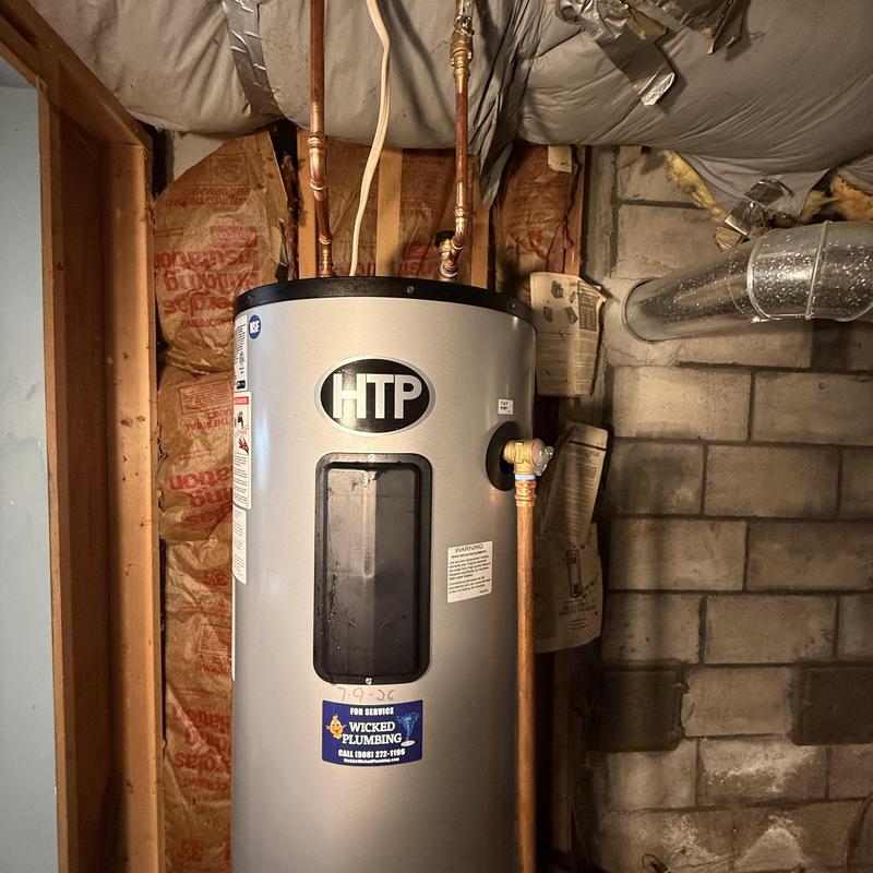 Water heater with copper piping in basement