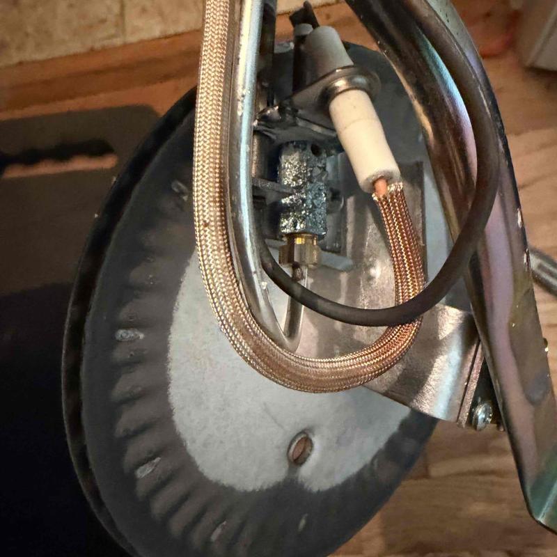 Water heater thermocouple and pilot burner assembly close-up Water heater thermocouple and pilot burner assembly close-up