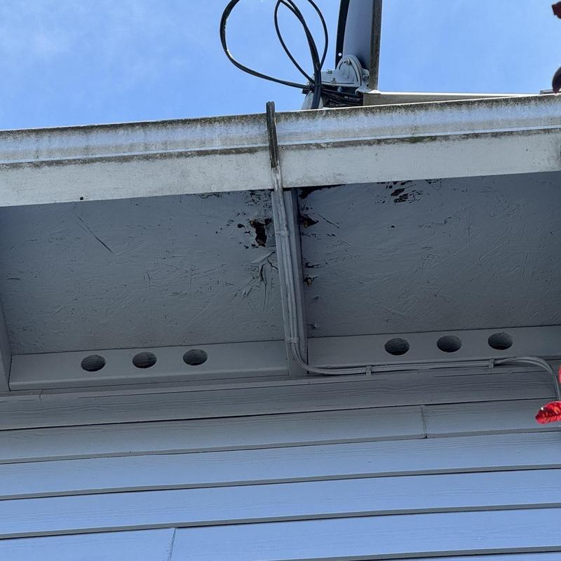 Eavestrough and fascia with rust and cable installation