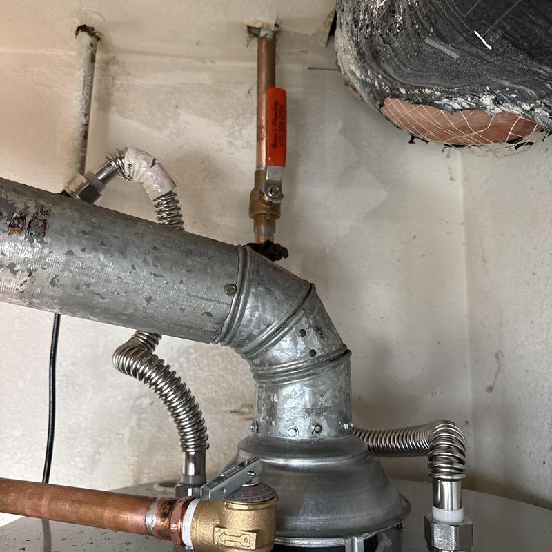 Water heater vent pipe and copper supply lines installed