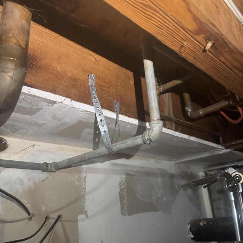 Gas line repair with galvanized pipe and cap installation