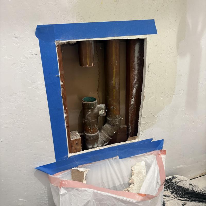 Laundry drain pipes with new 2-inch P-trap installation