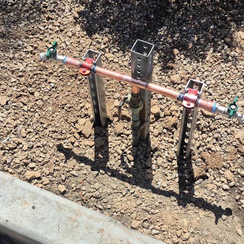 Copper hose bib assembly with shutoff valves in dirt