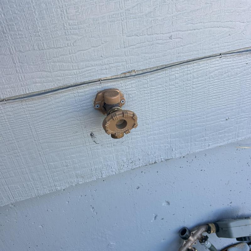 Hose bib installed on exterior textured wall Hose bib installed on exterior textured wall