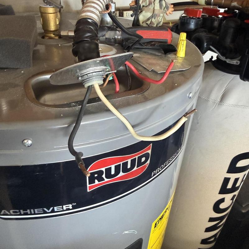 Water heater electrical wiring with tools on top