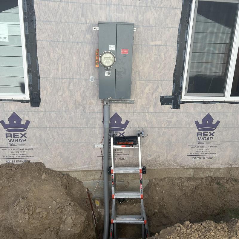 Main service panel and meter installation with ladder Main service panel and meter installation with ladder