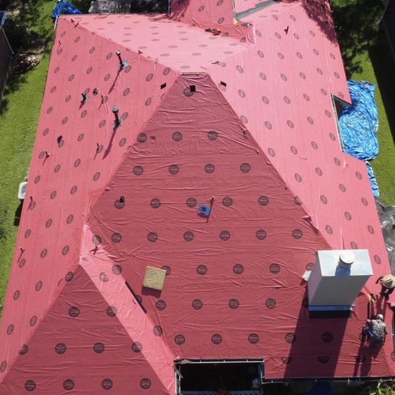 Roof underlayment installation on residential roof