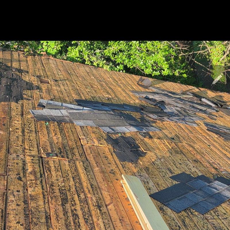 Roof wooden decking with removed old asphalt shingles