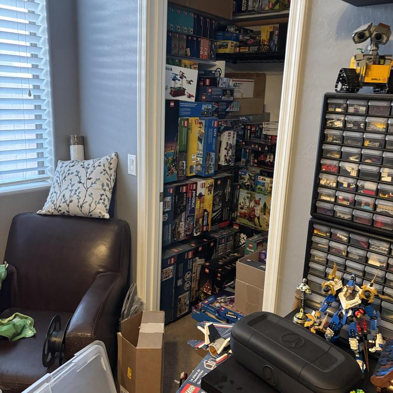 Storage closet filled with LEGO sets and parts