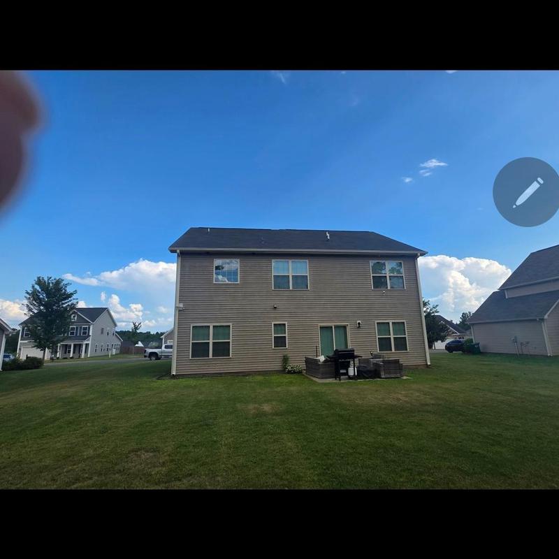 Asphalt shingle roof with wind damage inspection