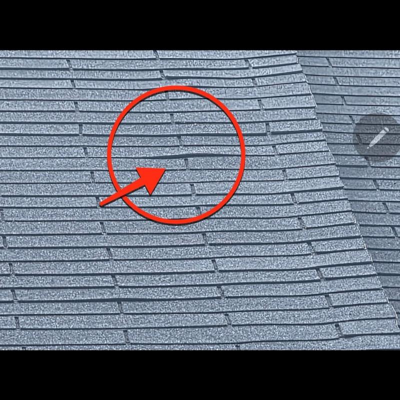 Roof shingles with wind damage circled and arrowed