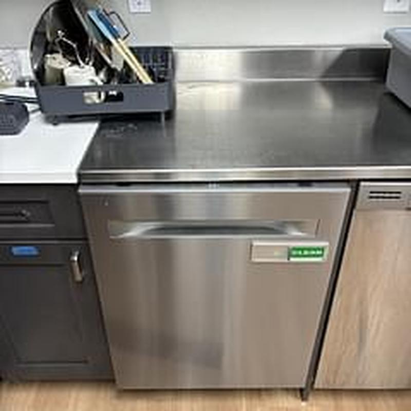 Dishwasher installation in church kitchen setting Dishwasher installation in church kitchen setting