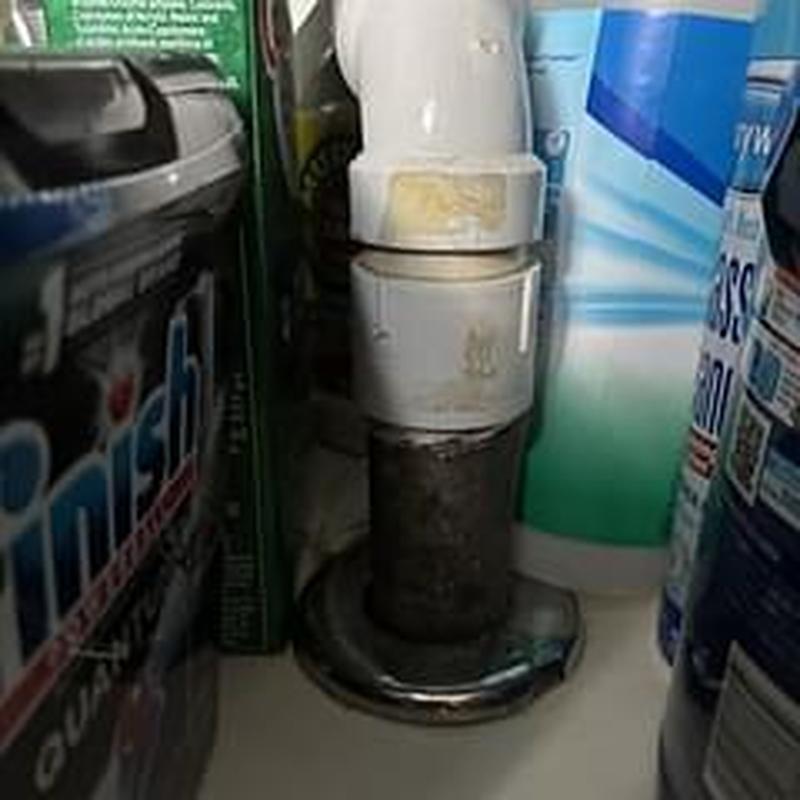 PVC drain pipe and fittings in basement cabinet