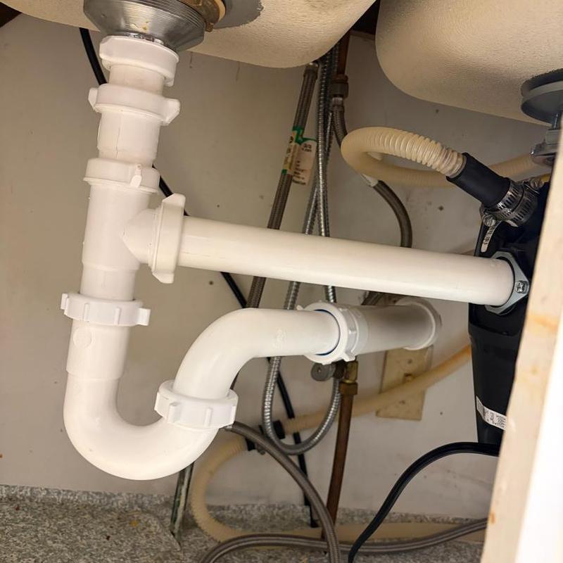 Garbage disposal and PVC repiping under sink Garbage disposal and PVC repiping under sink