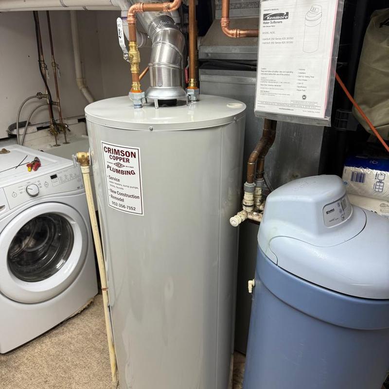 Water heater and water softener installation in laundry room Water heater and water softener installation in laundry room