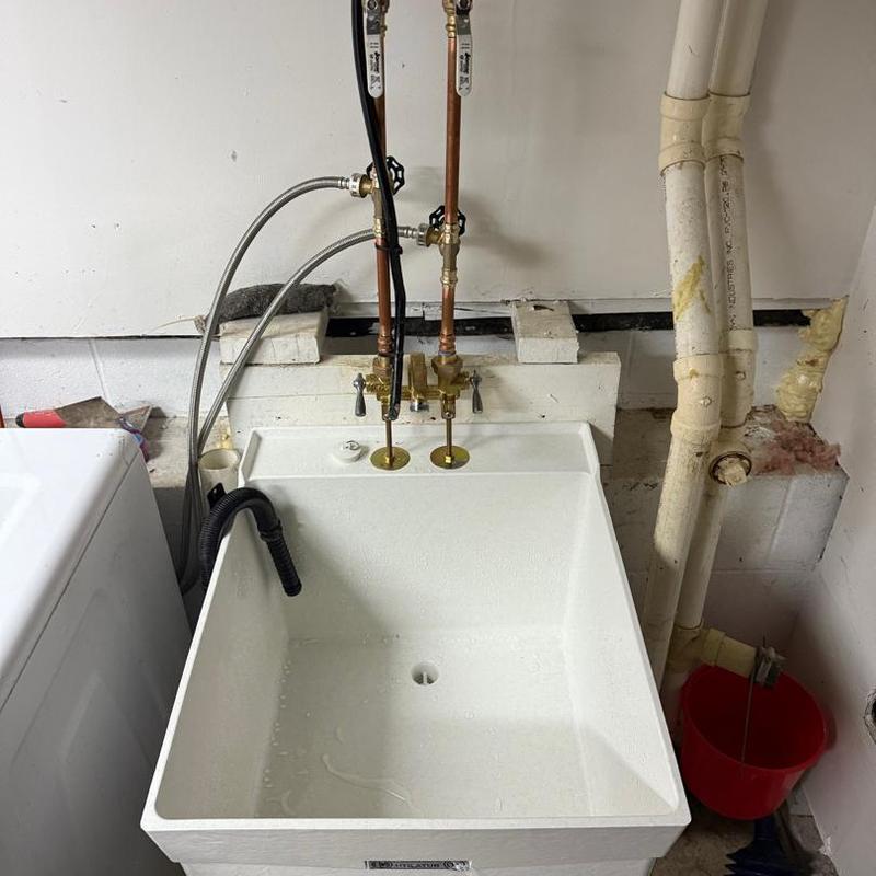 Laundry sink with faucet and plumbing connections Laundry sink with faucet and plumbing connections