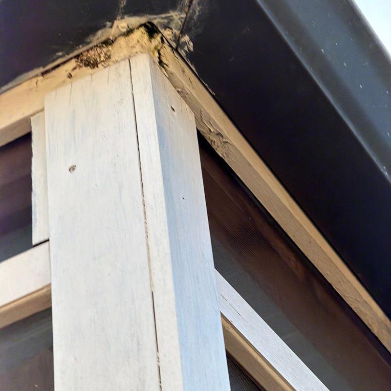 Roof flashing with visible wear and damage at corner