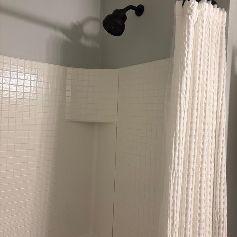 Showerhead and tiled shower stall with curtain Showerhead and tiled shower stall with curtain
